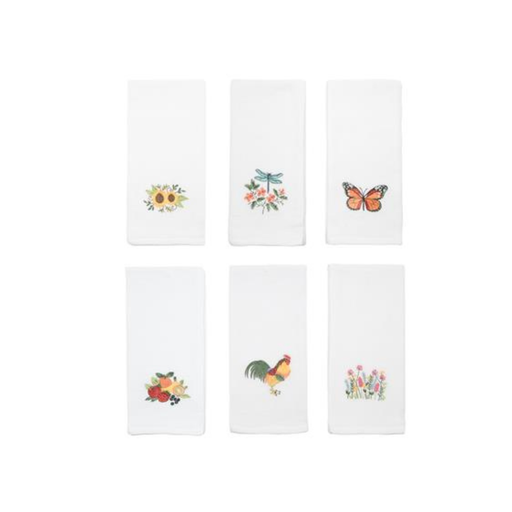 Set of six white napkins with embroidered designs on a white background