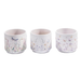 Three ceramic cups with floral and butterfly designs on a white background