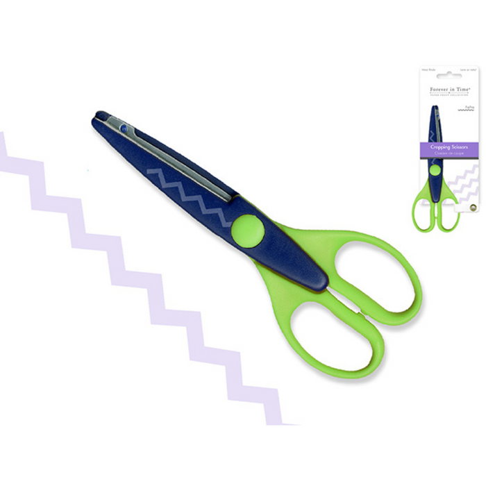 Green and blue scissors with packaging on a white background