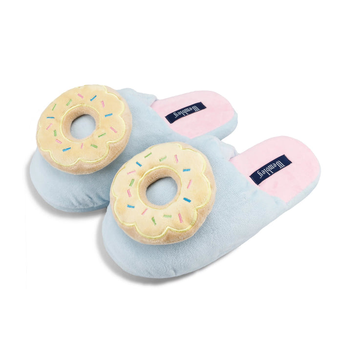 Pair of light blue slippers with donut design on a white background