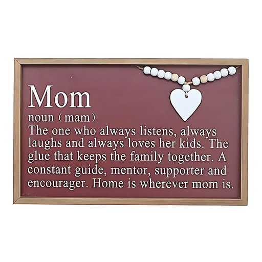 Framed burgundy wall sign with the definition of “Mom,” featuring white lettering, wood bead detail, and a white heart accent.