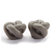 Two knot-shaped candles on a white background