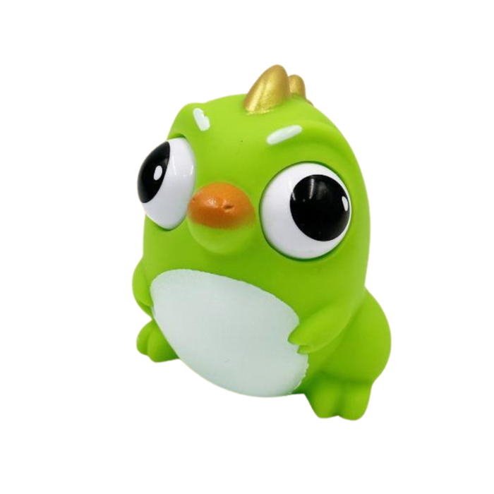 Green toy figure with large eyes and a gold horn on a white background