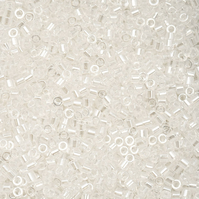 Close-up of small white beads on a light gray background