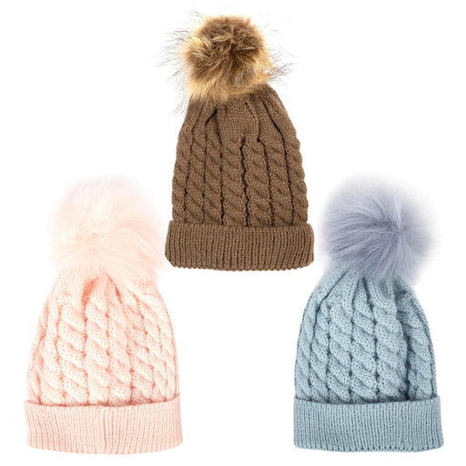 Three cable-knit beanie hats with fluffy pom-poms on a plain white background: one brown, one light pink, and one light blue.
