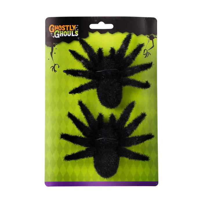 Two black fuzzy spider Halloween decorations in retail packaging on a white background.