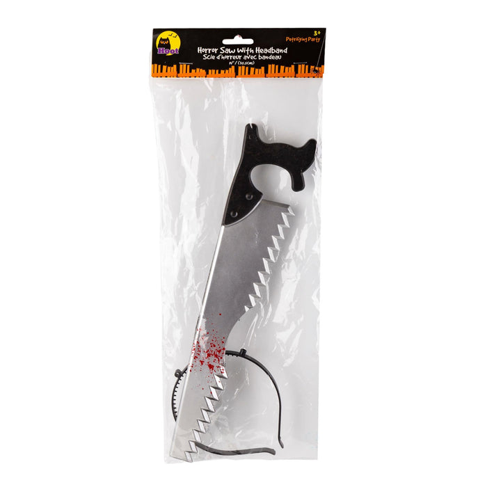 A packaged novelty prop saw with a black handle and red splatter details, sealed in a clear plastic bag with a black header card.