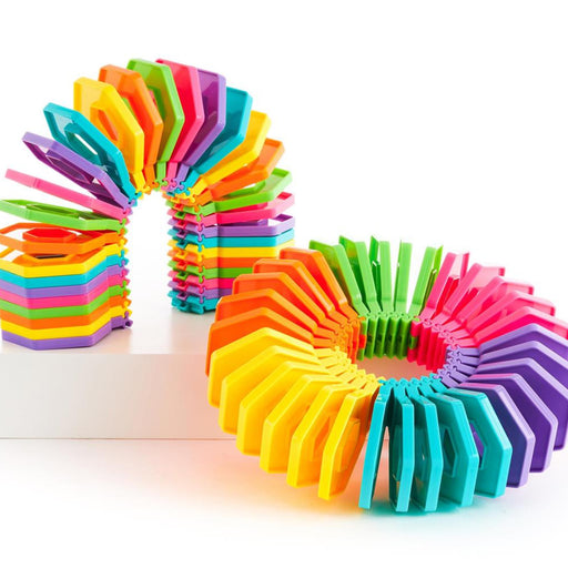 Colorful toy arranged in a circular pattern on a white background