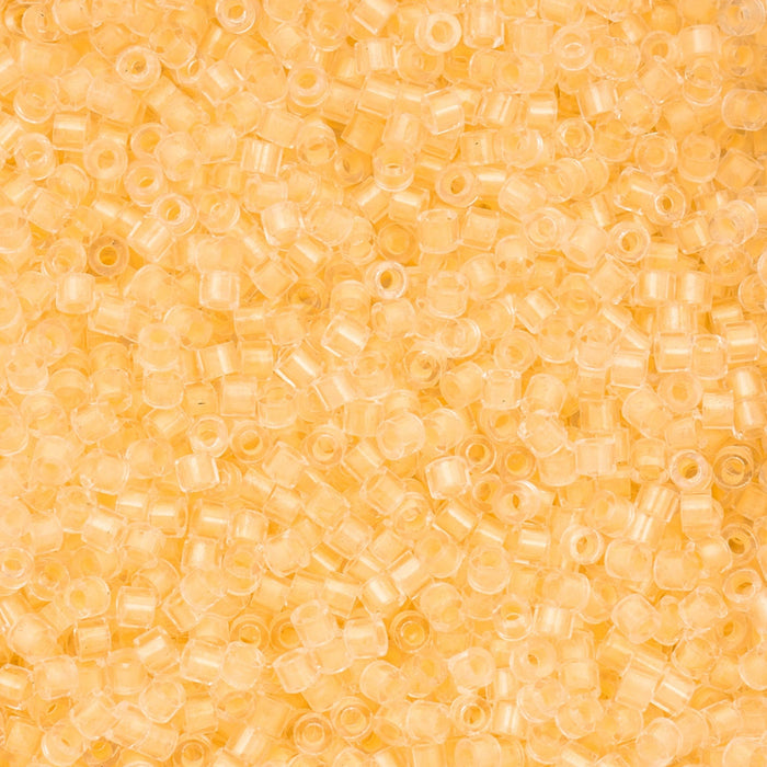Close-up of small yellow beads on a yellow background