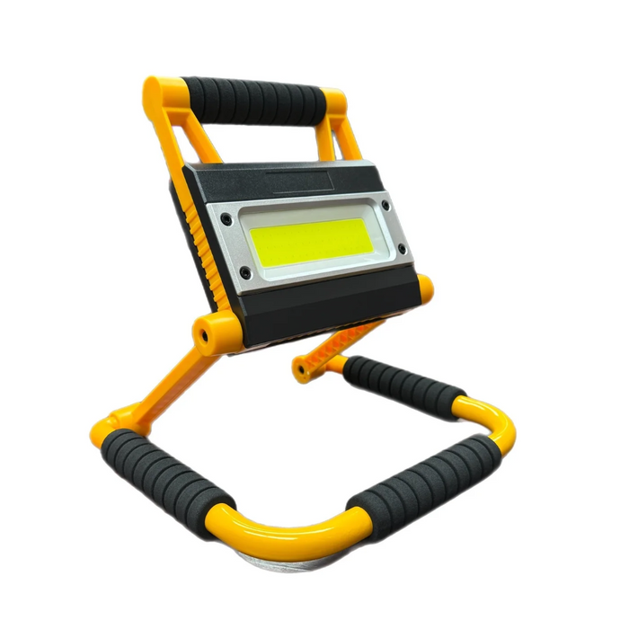 Yellow and black portable work light on a white background