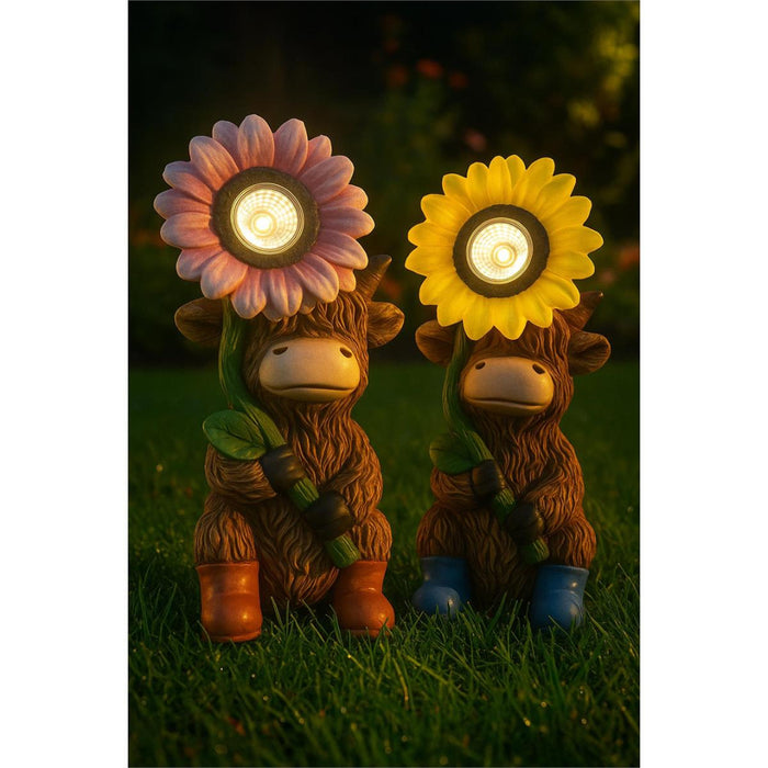 Two animal figurines with flower helmets on grass, glowing from within.