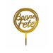 Gold acrylic "Bonne Fête" cake topper with script lettering in a circular frame and a single pick for easy placement on cakes.
