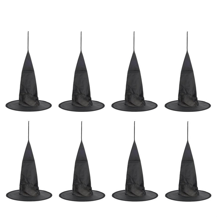 Set of eight black witch hats on a white background