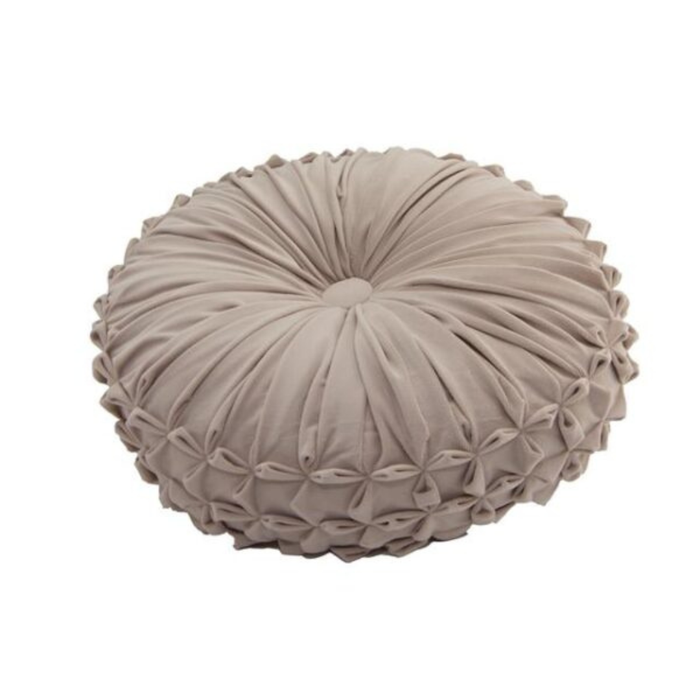 Round textured pillow on a white background