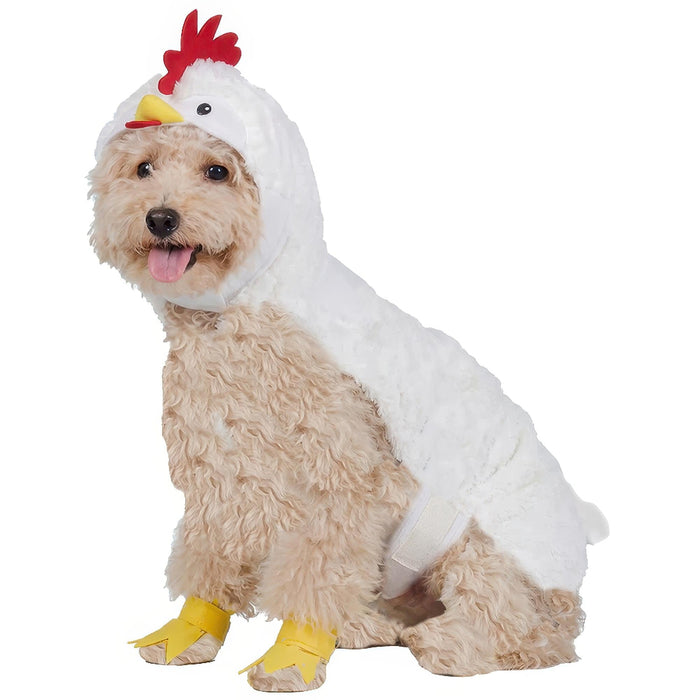 A small fluffy dog wearing a white chicken costume with a red comb, yellow beak, and yellow foot covers, photographed on a plain white background.