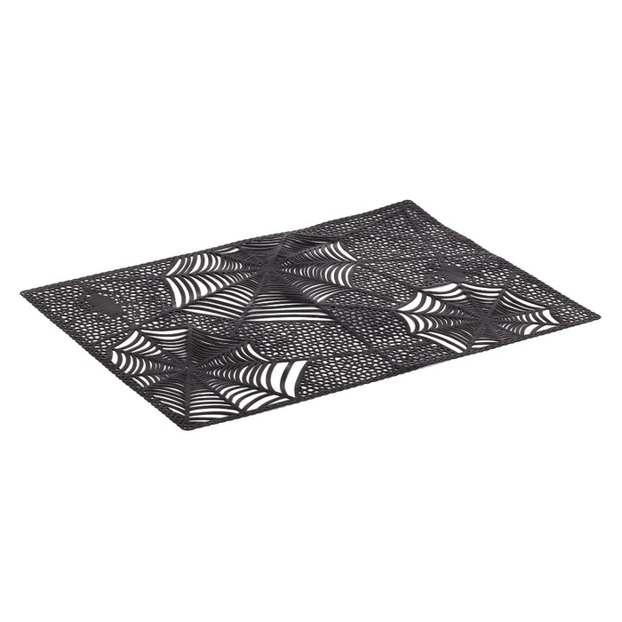A rectangular black placemat featuring a repeating white spiderweb pattern, shown on a plain white background.