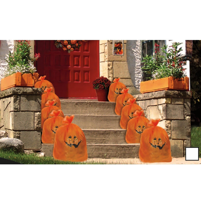 A set of orange Halloween trash bag yard signs with jack-o'-lantern faces arranged on outdoor stone steps in front of a house with a red door and potted plants.