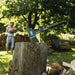 Person chopping wood with an axe in a forest setting