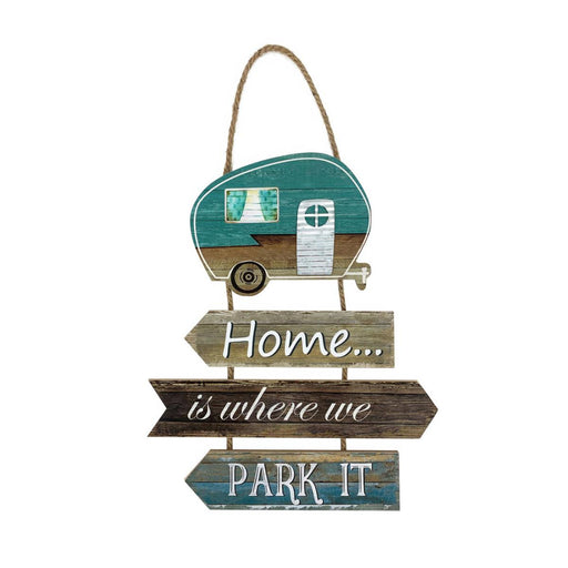 Decorative sign with camper design and text 'Home is where we park it' on a white background