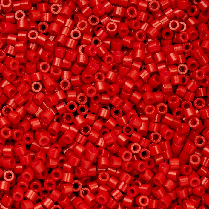 Close-up of red plastic beads with a uniform size and shape.