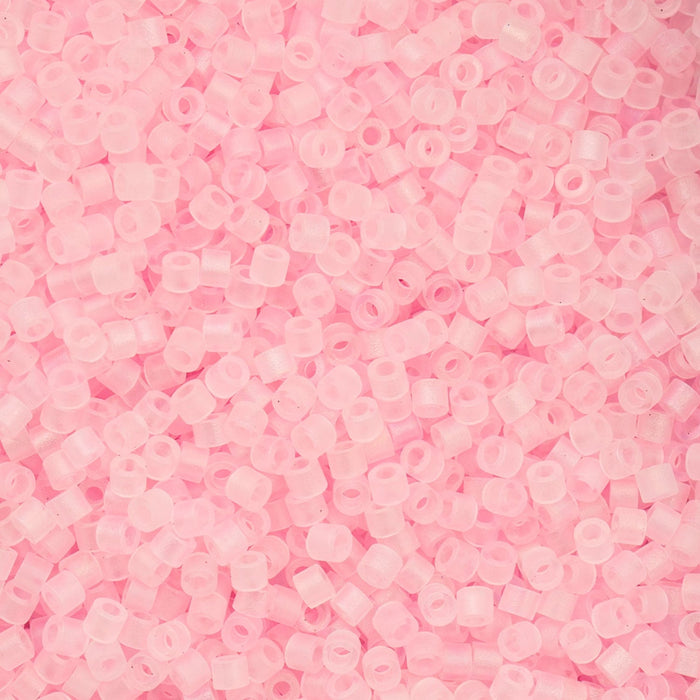 Close-up of pink plastic beads on a pink background