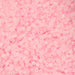 Close-up of pink plastic beads on a pink background