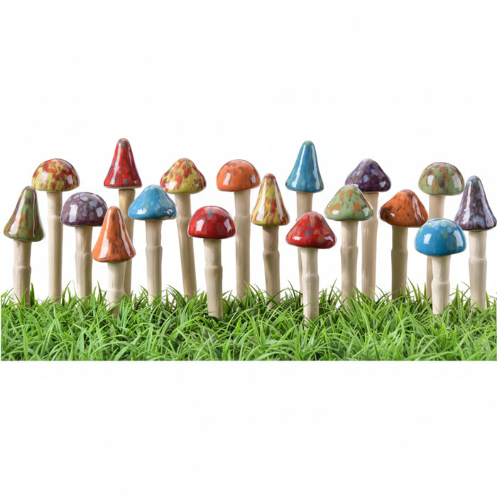 Colorful toy mushrooms on grass with a white background