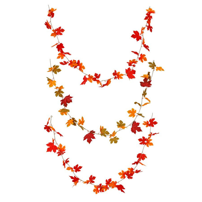 An autumn leaf garland made of artificial maple leaves in shades of red, orange, yellow, and green, arranged in a U-shape on a plain white background.