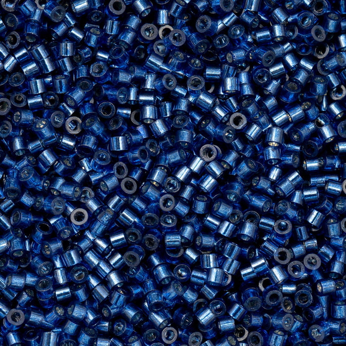Close-up of blue beads with a blue background