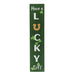 Decorative sign with 'Have a Lucky Day' text on a green background