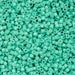 Turquoise plastic beads densely packed together