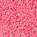 Close-up of pink beads with a pink background