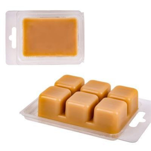 Caramel-colored wax bars in a mold on a white background