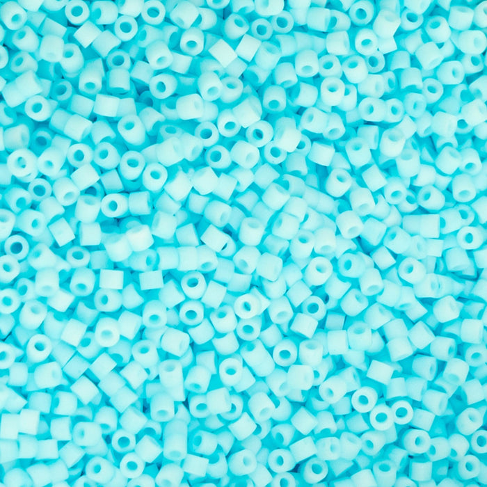 Close-up of light blue beads on a blue background