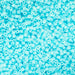 Close-up of light blue beads on a blue background