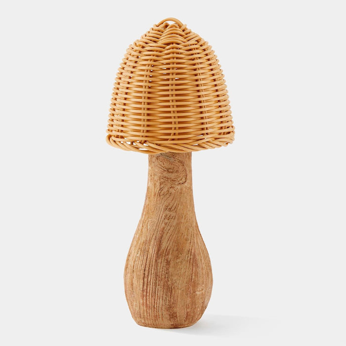 Wooden pepper grinder with wicker top on a white background