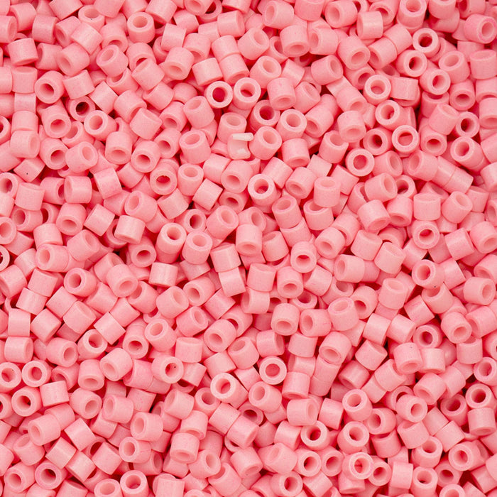 Close-up of pink beads with a uniform color and small size.