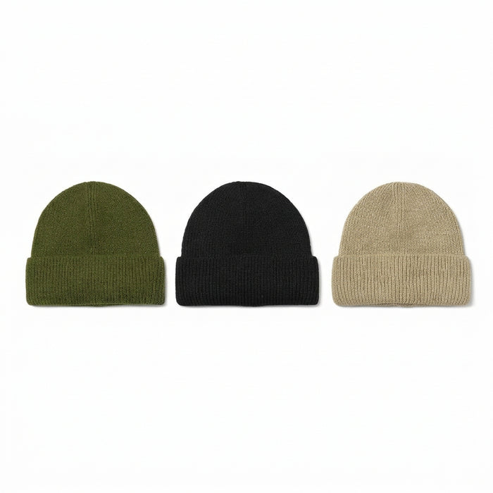 Three ribbed knit beanie hats in olive green, black, and beige, arranged side by side on a plain white background.