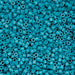 Turquoise plastic beads densely packed together