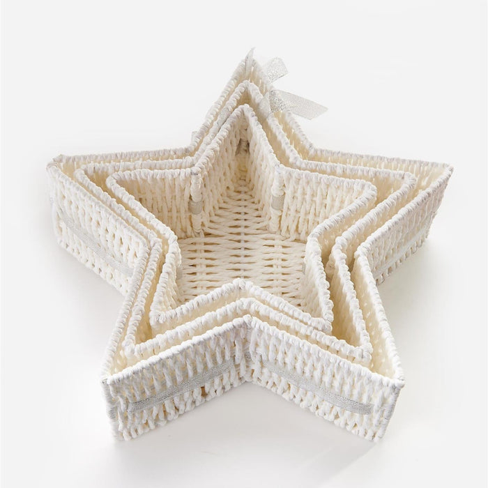 A set of nested five-pointed star-shaped baskets made from woven natural fiber, shown on a clean white background.