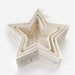 A set of nested five-pointed star-shaped baskets made from woven natural fiber, shown on a clean white background.