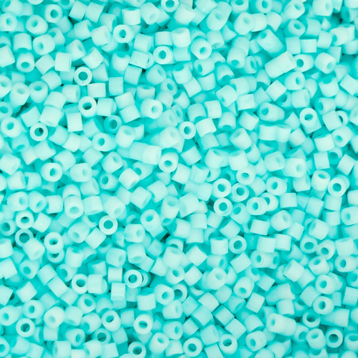 Turquoise pony beads on a turquoise background