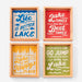 Four wooden panels with lake-themed sayings on a white background