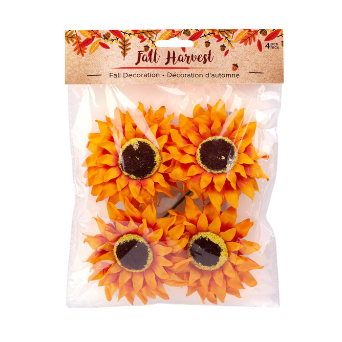 Pack of 4 artificial orange sunflowers with dark brown centers in a clear plastic bag with a brown 'Fall Harvest' header card.
