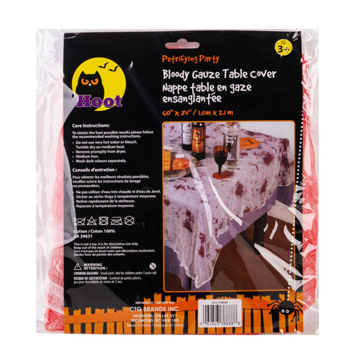 Hoot Petting Party Bloody Gauze Table Cover in its retail packaging, featuring a black and orange label with product details and a photo of the tablecloth in use.