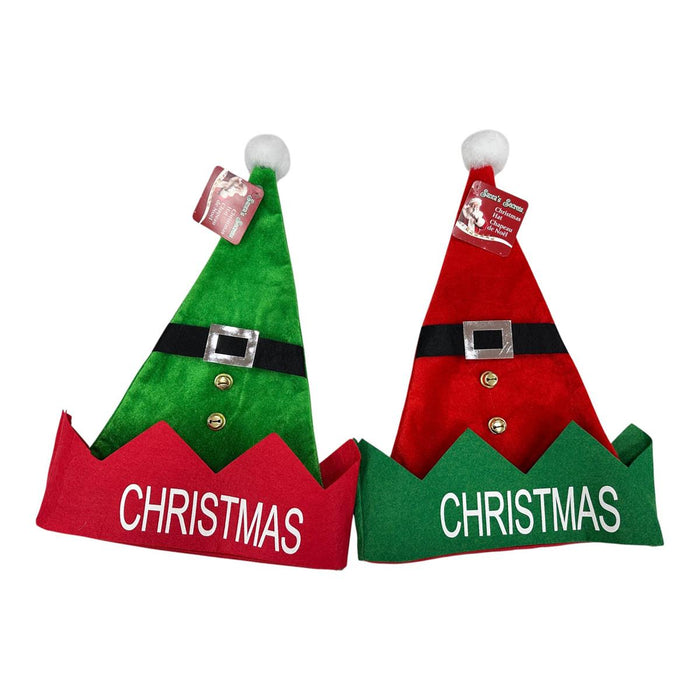 Two plush Christmas elf hats on a white background, one green with a red brim and one red with a green brim, both with black faux belts and white pom-poms. Both brims read 'CHRISTMAS' in white text.