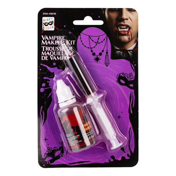 Vampire makeup kit in blister packaging, containing a small bottle of red liquid and a syringe applicator on a black and purple backing card with vampire-themed graphics.