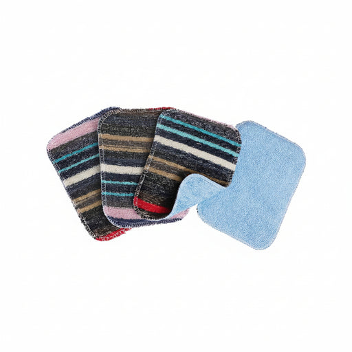 Four rectangular cleaning pads or cloths arranged in a fan on a white background. Three pads show a striped pattern in navy, beige, white, pink, and red, while the front pad is light blue and appears to be the reverse side or a different variant.