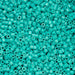 Turquoise plastic beads densely packed together