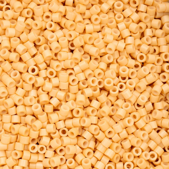 Close-up of beige plastic beads with holes